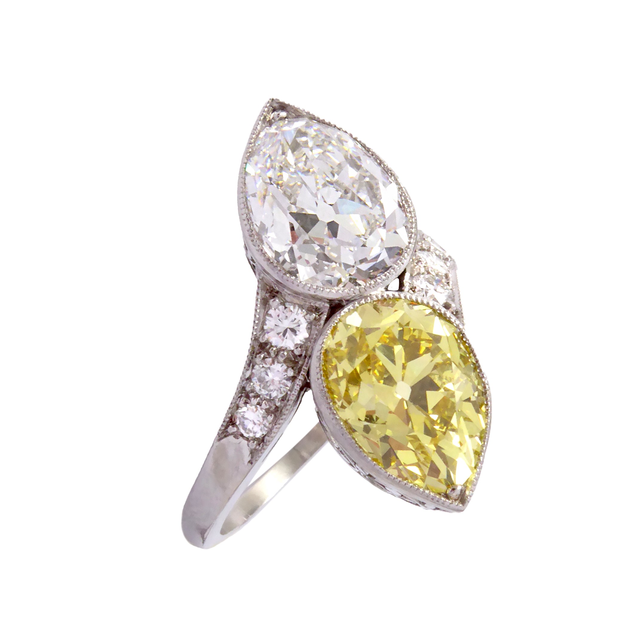 Two stone yellow and white diamond crossover ring, set with a 3.30ct fancy vivid yellow pear diamond opposite a 3.26ct E VS1 pear diamond,